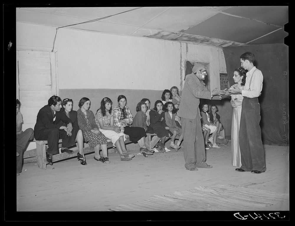 Players and audience at traveling Spanish-American show. Penasco, New Mexico by Russell Lee
