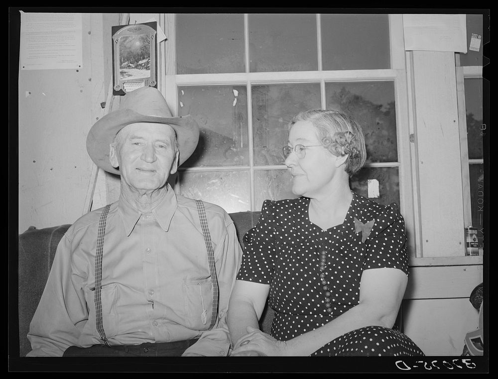 Postmaster and his wife. Pie Town, New Mexico by Russell Lee