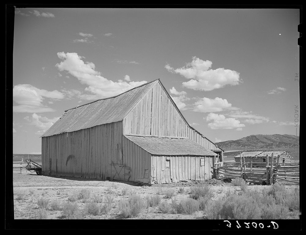 Barn and outbuildings of Mormon farmer. Box Elder County, Utah by Russell Lee