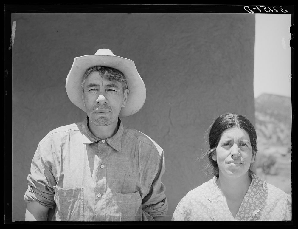 Spanish-American farmer and his wife. Amalia, New Mexico by Russell Lee