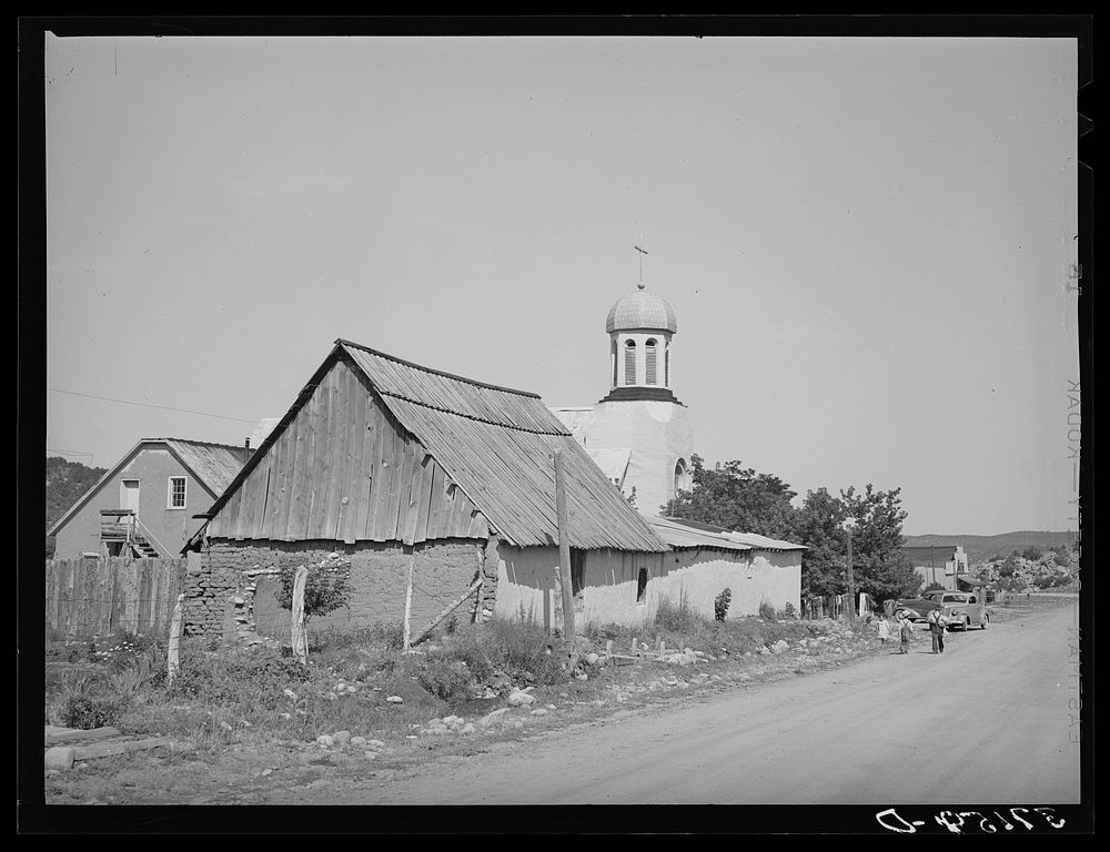 Catholic church, rectory and barn. Penasco, New Mexico by Russell Lee