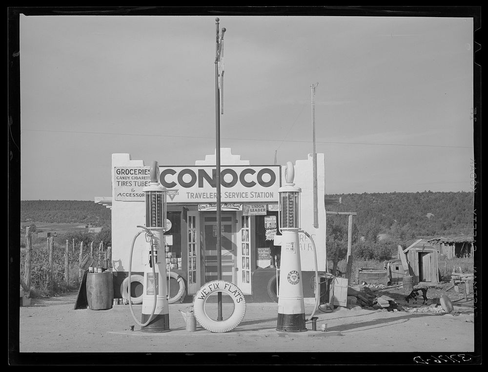 [Untitled photo, possibly related to: Filling station is only building of modern design in the Spanish-American village of…