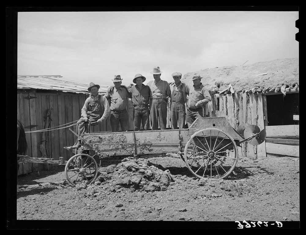 Box Elder County, Utah. Members of the FSA (Farm Security Administration) cooperative manure spreader by Russell Lee