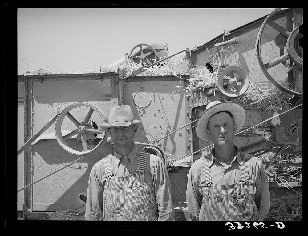 Members of FSA (Farm Security Administration) cooperative thresher. Box Elder County, Utah by Russell Lee