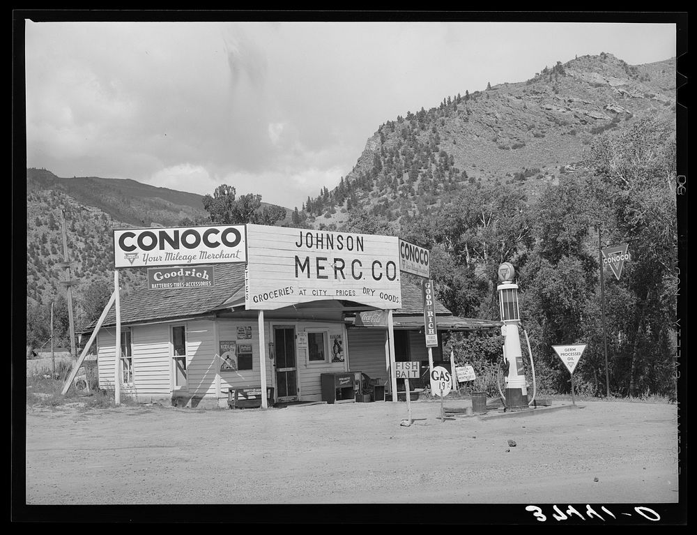 Grocery store and filling station at Cimarron, Colorado. This is a sheep shipping center by Russell Lee