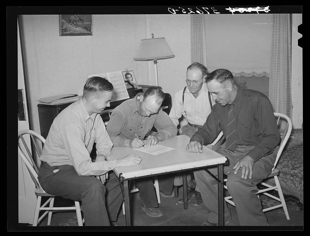 Committee of Cornish corn machinery cooperative signing an agreement for purchase of machinery. Cornish, Utah by Russell Lee