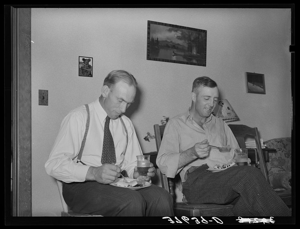 Mormon farmers having refreshments of watermelon and fruit punch after cooperative FSA (Farm Security Administration)…