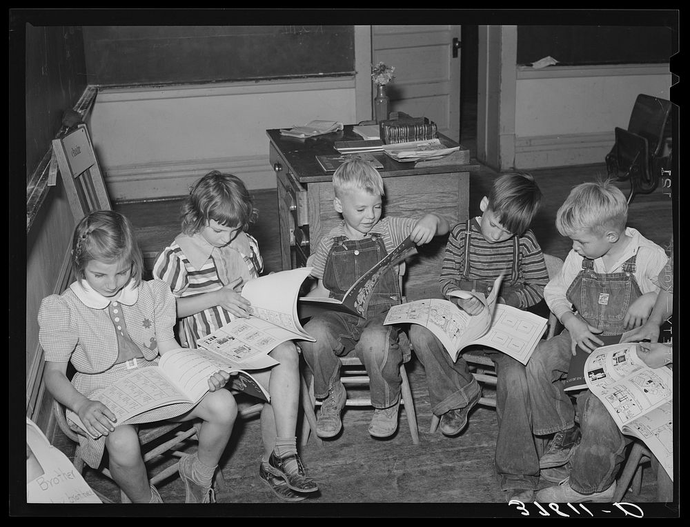 Children looking at picture books at school, Santa Clara, Utah. See general caption by Russell Lee