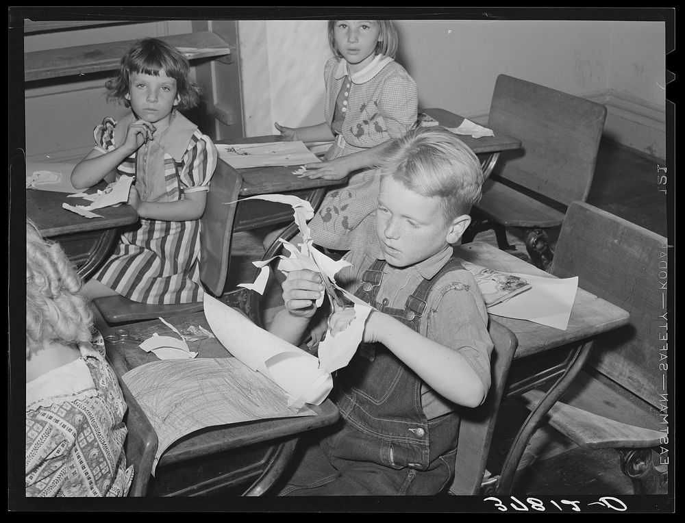 Grade school pupil making a cut-out, Santa Clara, Utah. See general caption by Russell Lee