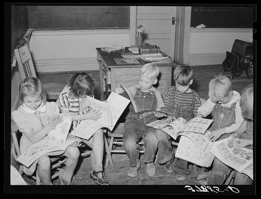 [Untitled photo, possibly related to: Children looking at picture books at school, Santa Clara, Utah. See general caption]…