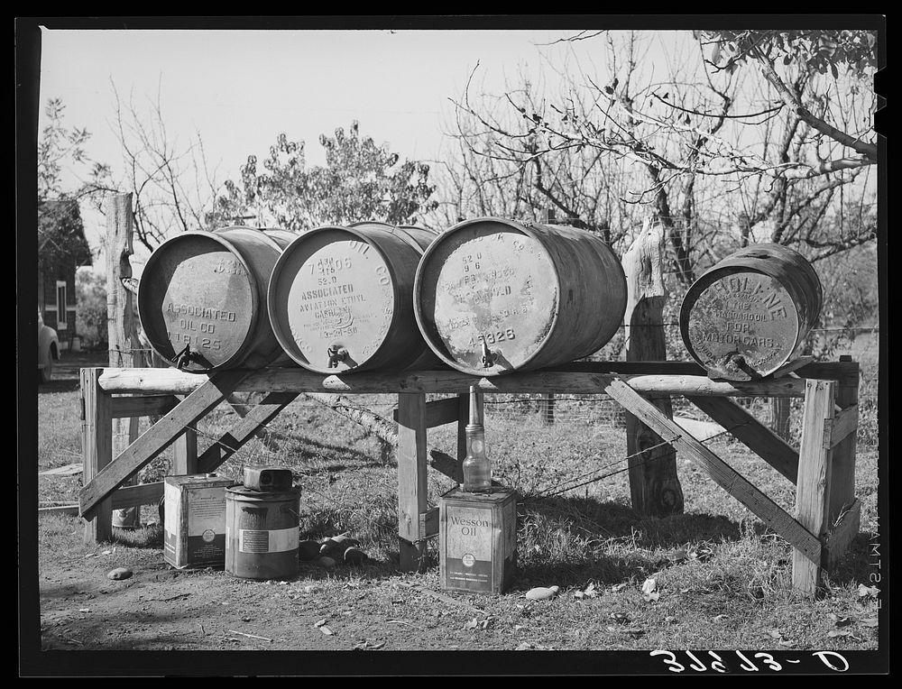 Barrels of fuel for tractor on farm of Perry Warner, small farmer in Tehama County, California by Russell Lee