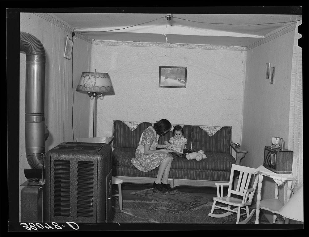 Interior of living room of married couple living in remodeled boxcar. Earl Fruit Company ranch. Kern County, California by…