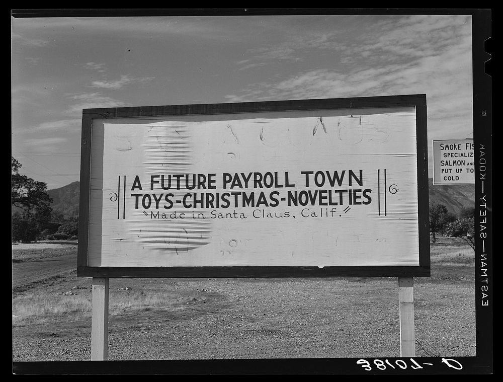 Sign at Santa Claus, California, Shasta County, California. When this picture was taken there was only one building in town…