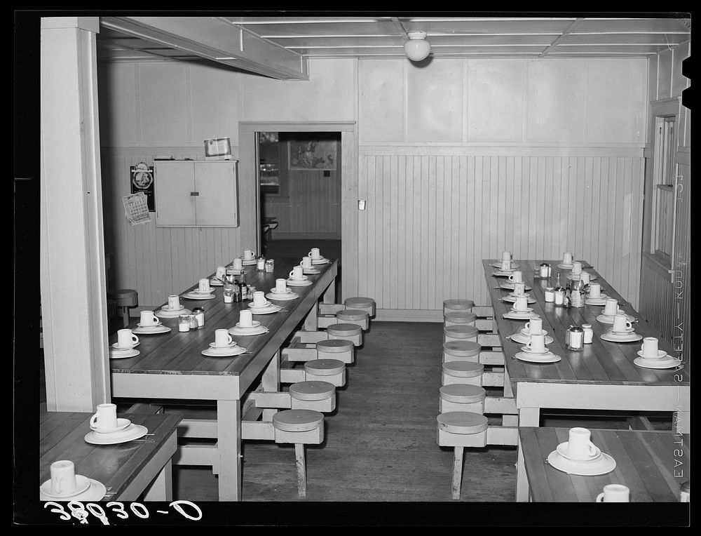 Tables in mess hall for single men who are permanent workers at the Earl Fruit Company ranch. Kern County, California by…