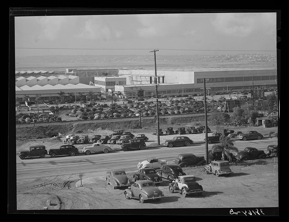 San Diego, California. Cars parked outside Consolidated Aircraft Corporation by Russell Lee