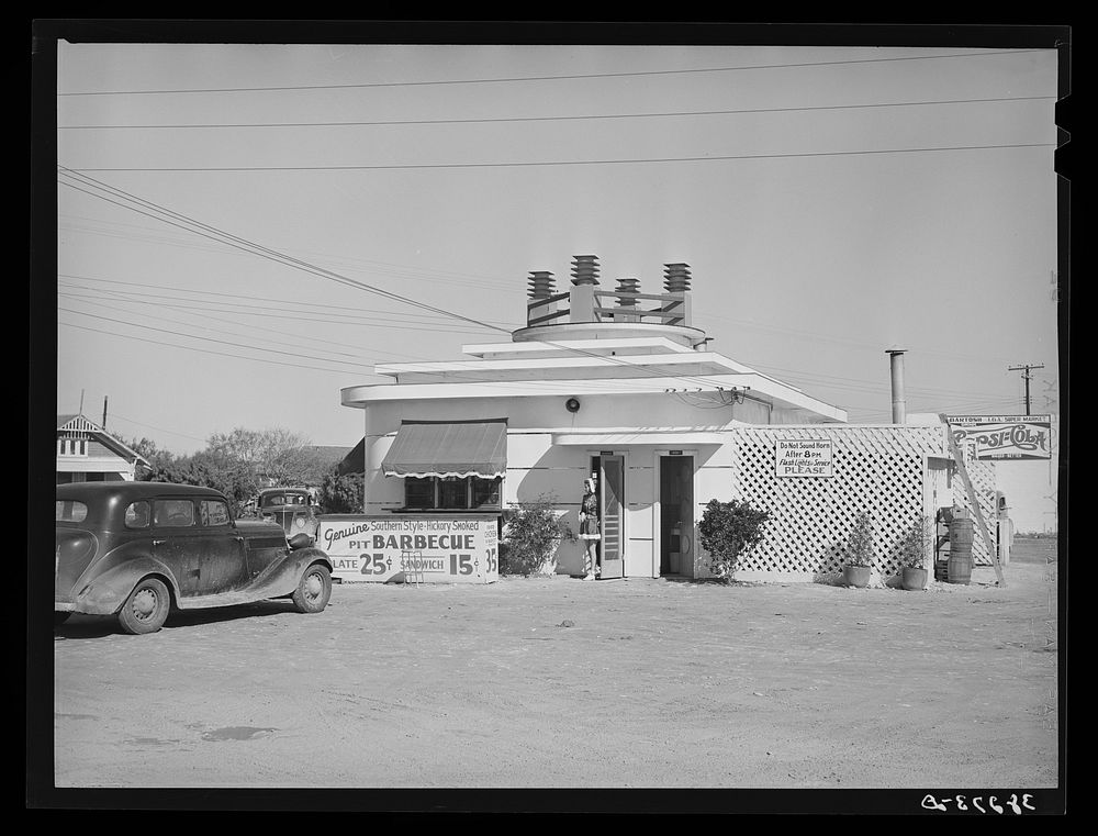 Drive in sandwich stand which was built at the beginning of construction work at naval air base. Corpus Christi, Texas by…