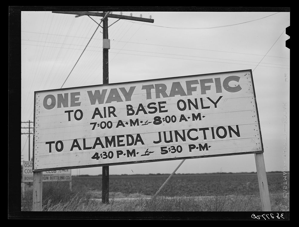Sign signifying one way traffic during the rush hours on the roads leading from town to the naval air base. Corpus Christi…