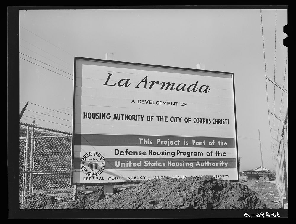Sign at U.S.H.A. project under construction. Corpus Christi, Texas. This project will provide housing for two hundred forty…