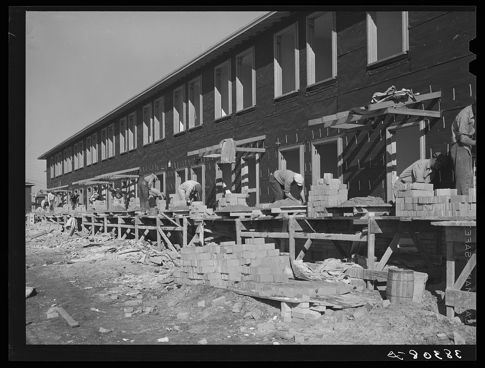 Construction work on housing for two hundred forty-nine married enlisted men and civilian employees at the naval air…