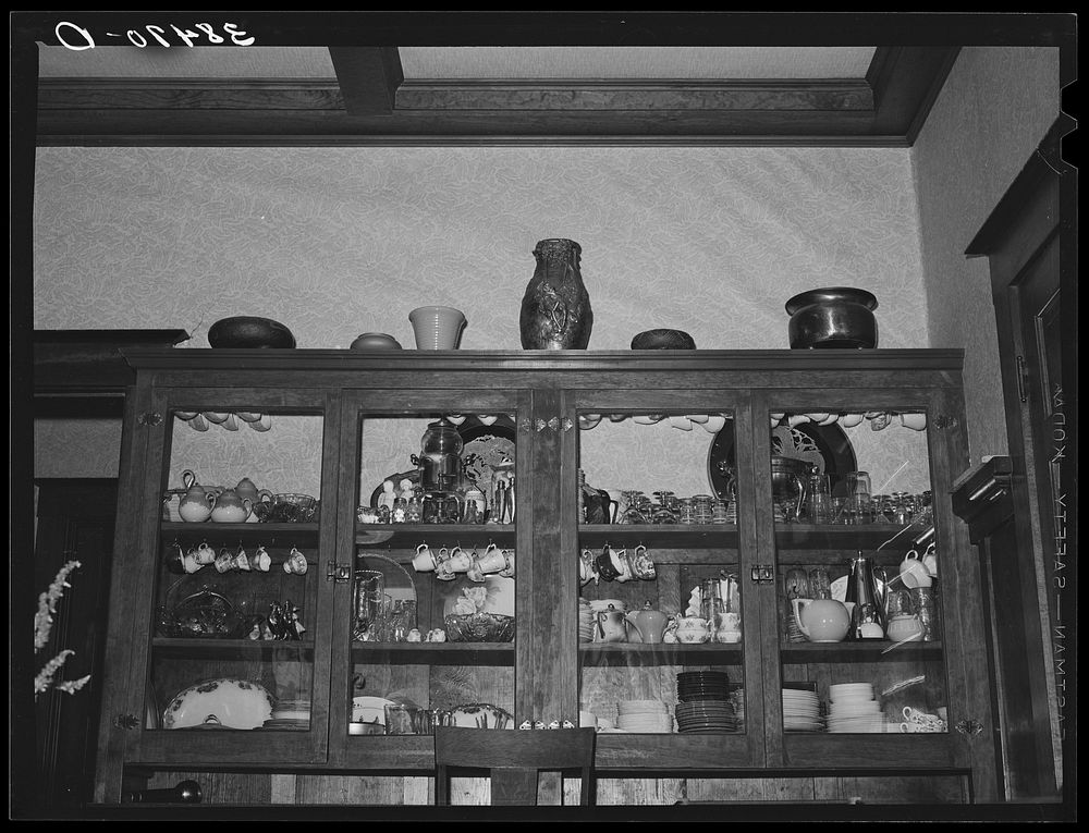 China cabinet in home of fruit farmer. Placer County, California. These fruit specialists have had a high standard of…