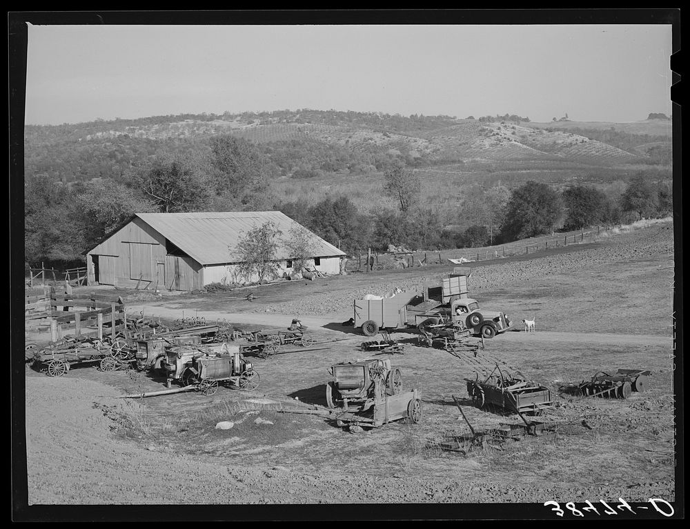 [Untitled photo, possibly related to: Barn and farm equipment of fruit farmer. Placer County, California. Notice the…
