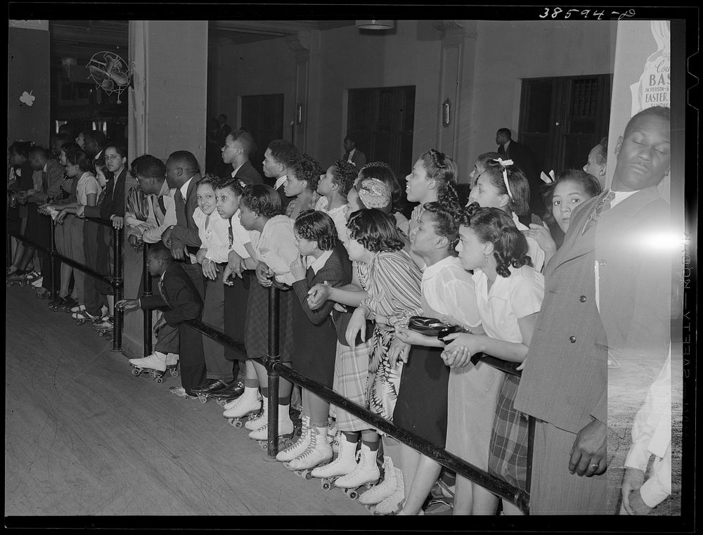 Crowds watching rollerskating exhibition. Chicago, Illinois by Russell Lee