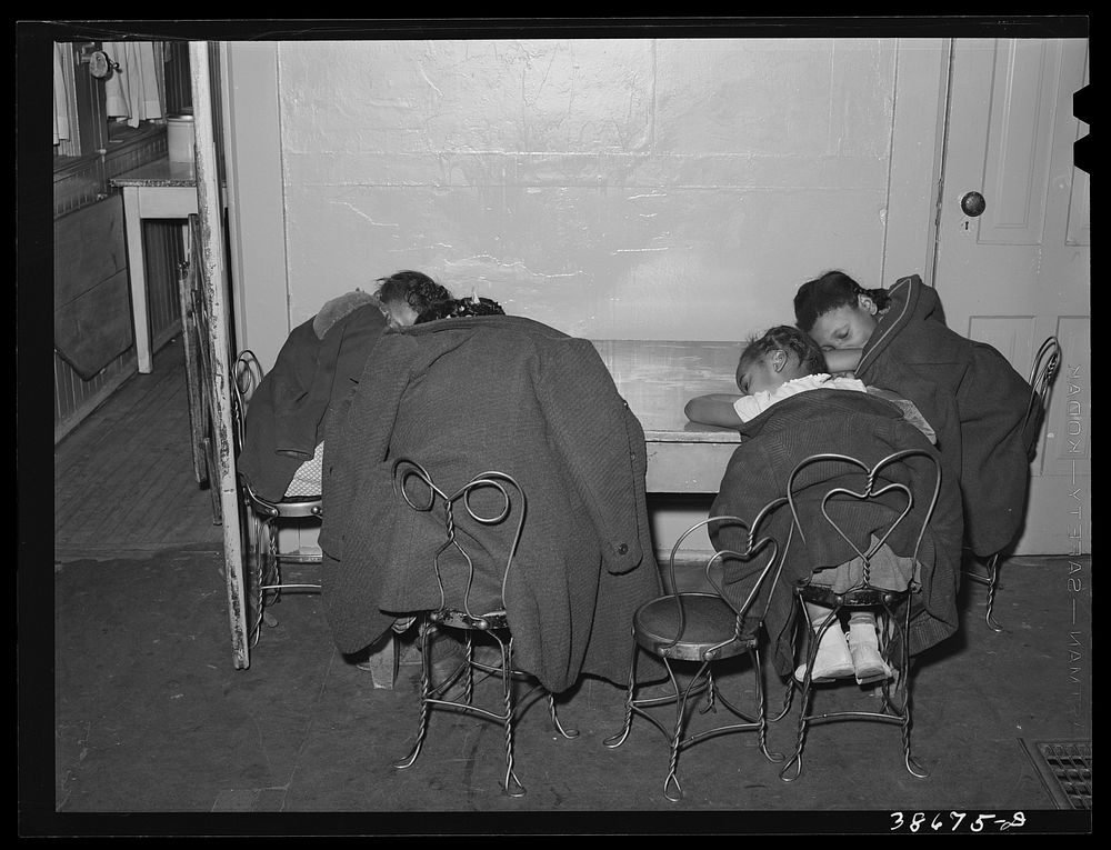 Children sleeping during rest period at a nursery. There were not enough beds to go around. Chicago, Illinois by Russell Lee