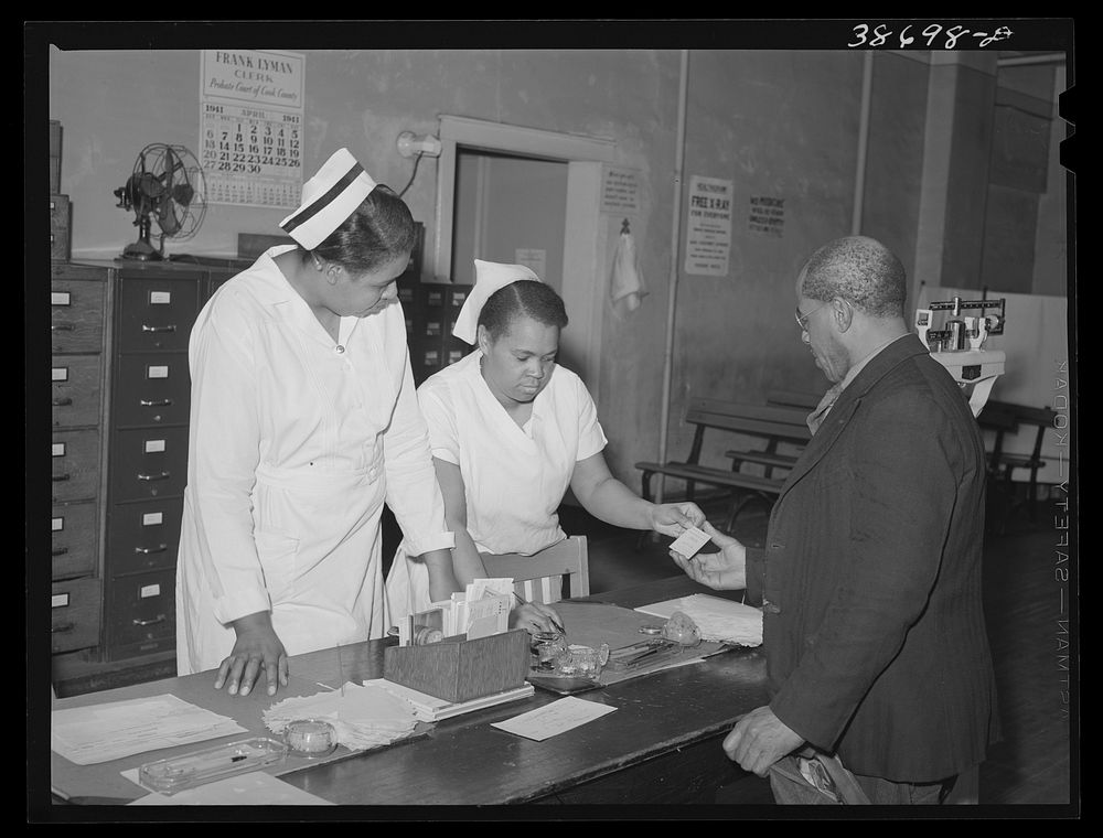 Clinic patient receiving instruction card at municipal tuberculosis sanitarium. Chicago, Illinois by Russell Lee