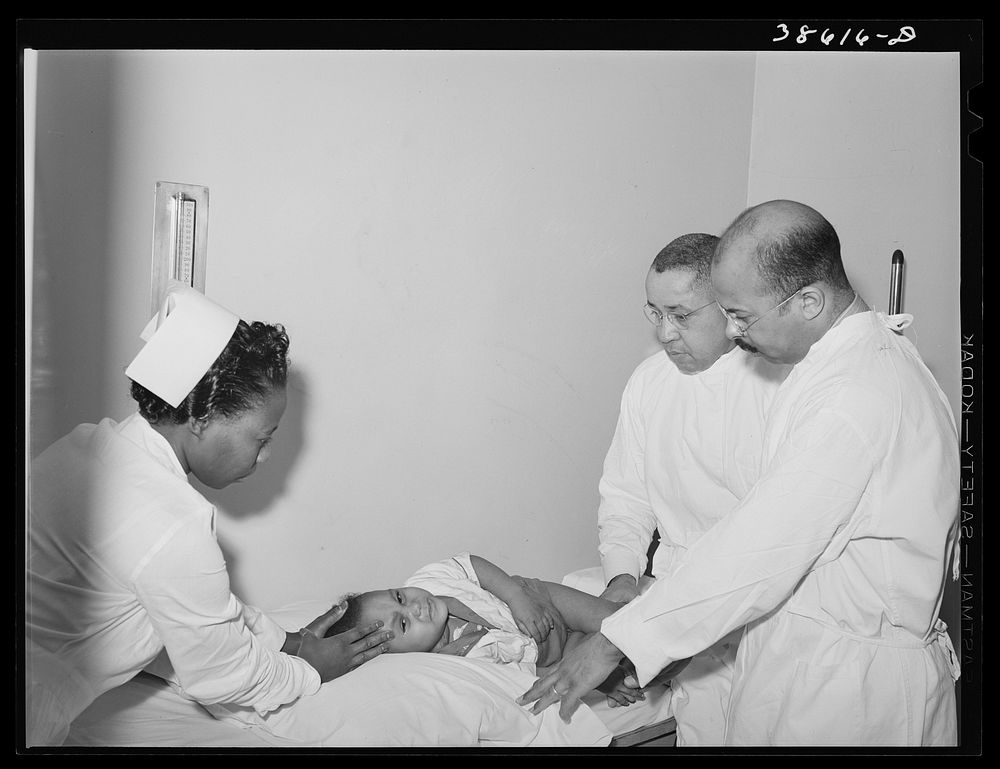 Examining baby at clinic of  hospital. Chicago, Illinois by Russell Lee