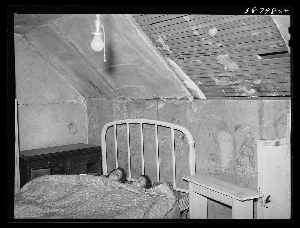 Upstairs bedroom of family on relief. Chicago, Illinois by Russell Lee