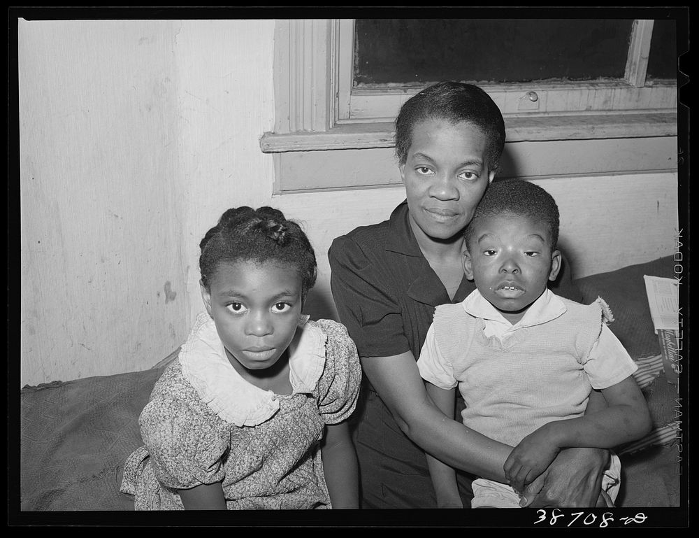 Mother with her children at home. Chicago, Illinois by Russell Lee