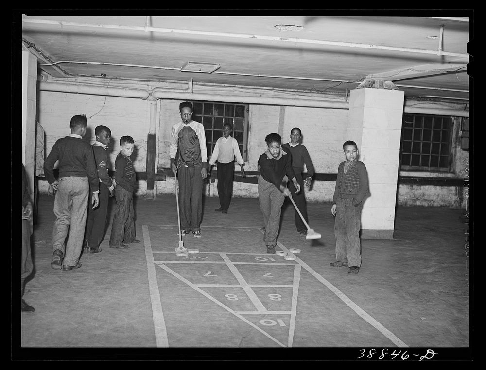 Shuffleboard being played in basement of Good Shepherd Community Center. Chicago, Illinois by Russell Lee