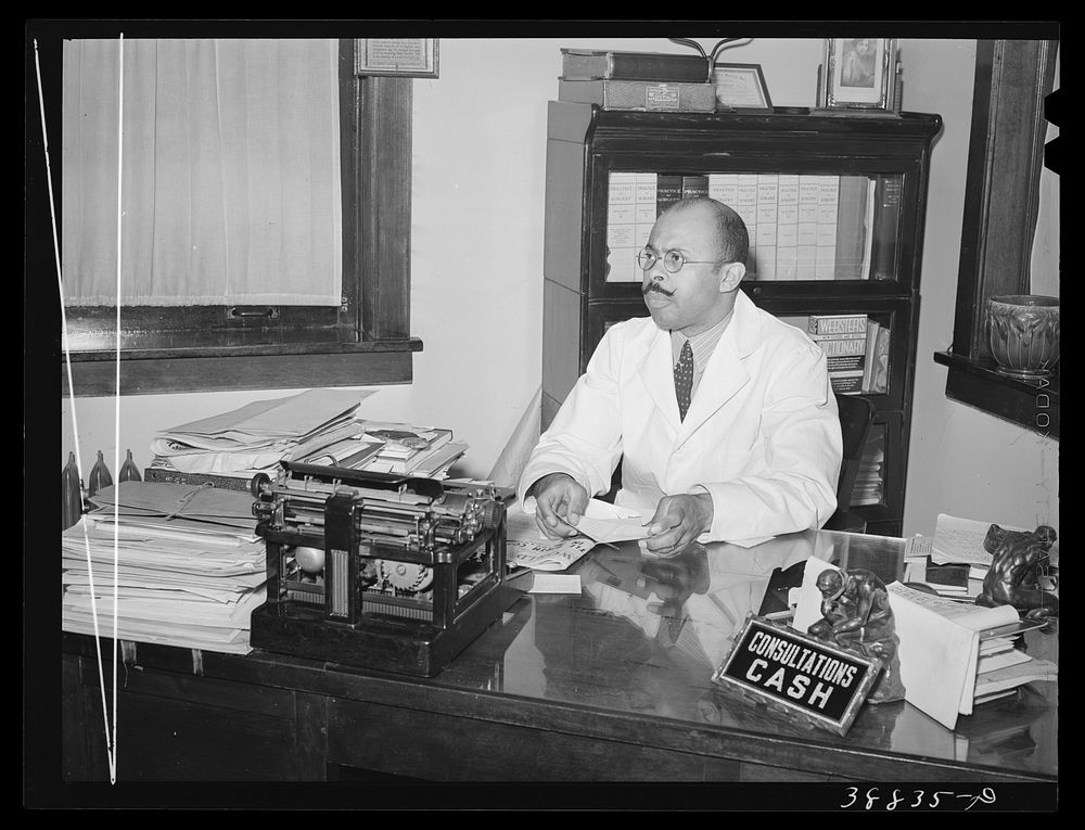 Doctor in his office. Southside of Chicago, Illinois by Russell Lee