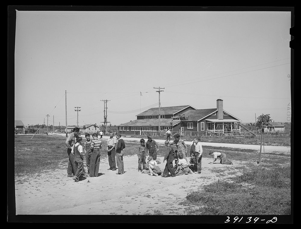 Playing during recess at the school at the FSA (Farm Security Administration) camp for farm workers. Caldewell, Idaho by…