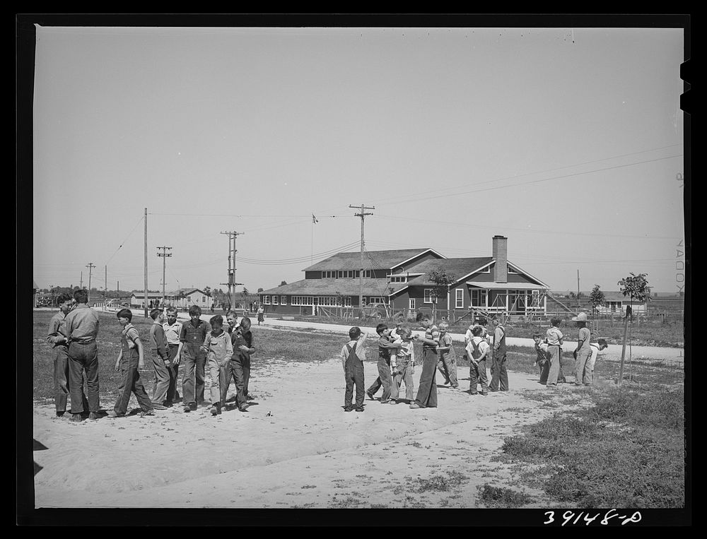 Schoolchildren playing at recess at the FSA (Farm Security Administration) farm workers' camp. Caldwell, Idaho by Russell Lee