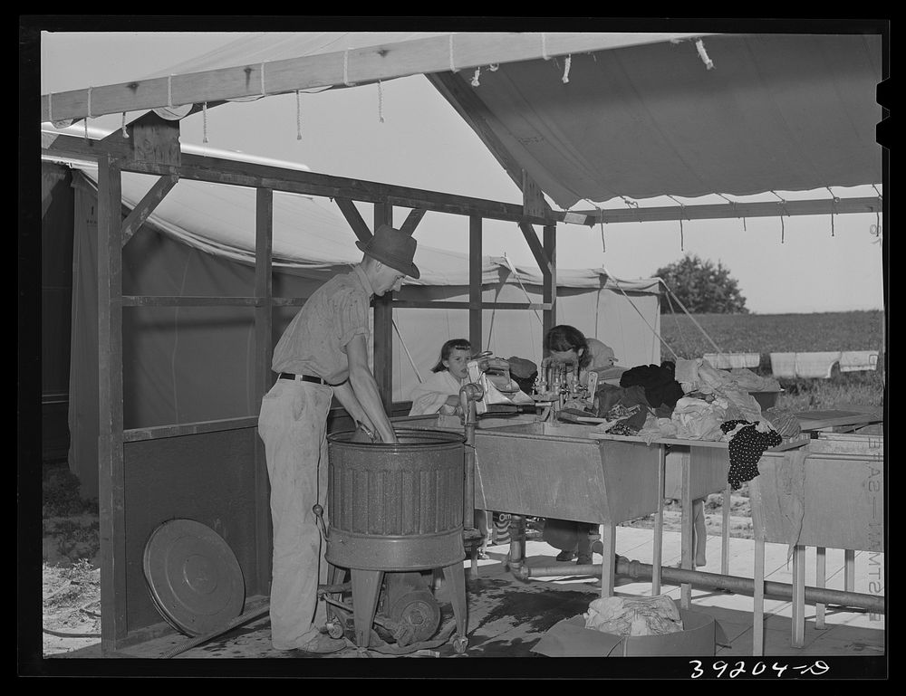 Laundry at the FSA (Farm Security Administration) migratory labor camp mobile unit. Wilder, Idaho by Russell Lee