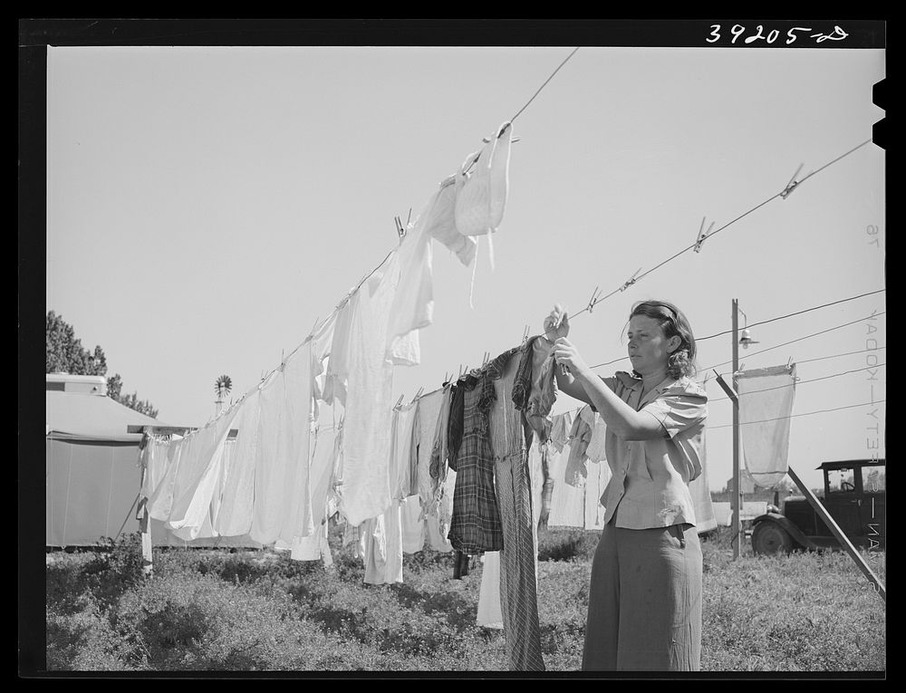 Hanging out the wash at the FSA (Farm Security Administration) migratory labor camp mobile unit. Wilder, Idaho by Russell Lee