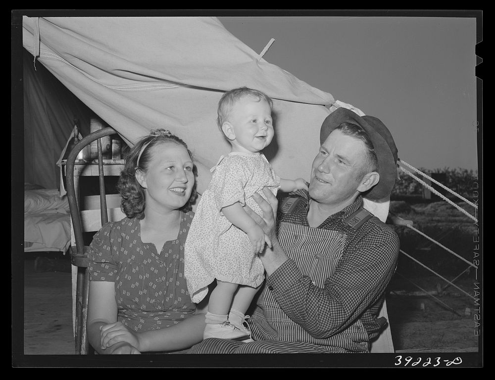 Farm worker, his wife and child at the FSA (Farm Security Administration) migratory labor camp mobile unit. Wilder, Idaho by…