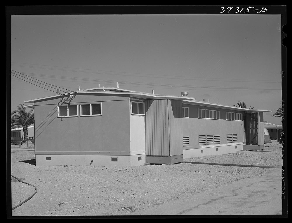 Building which houses the sanitary facilities at FSA (Farm Security Administration) camp for defense workers. San Diego…