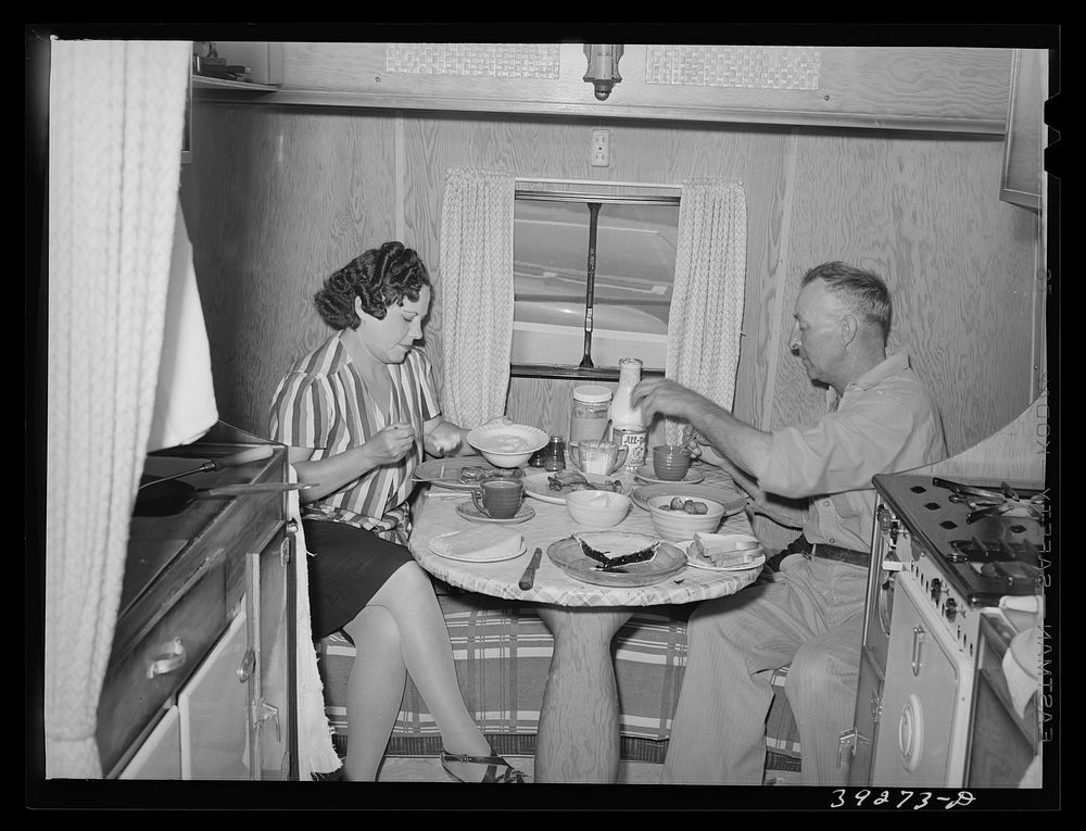 Construction worker of Kearney-Mesa and his wife have lunch in their trailer home. San Diego, Calfornia by Russell Lee