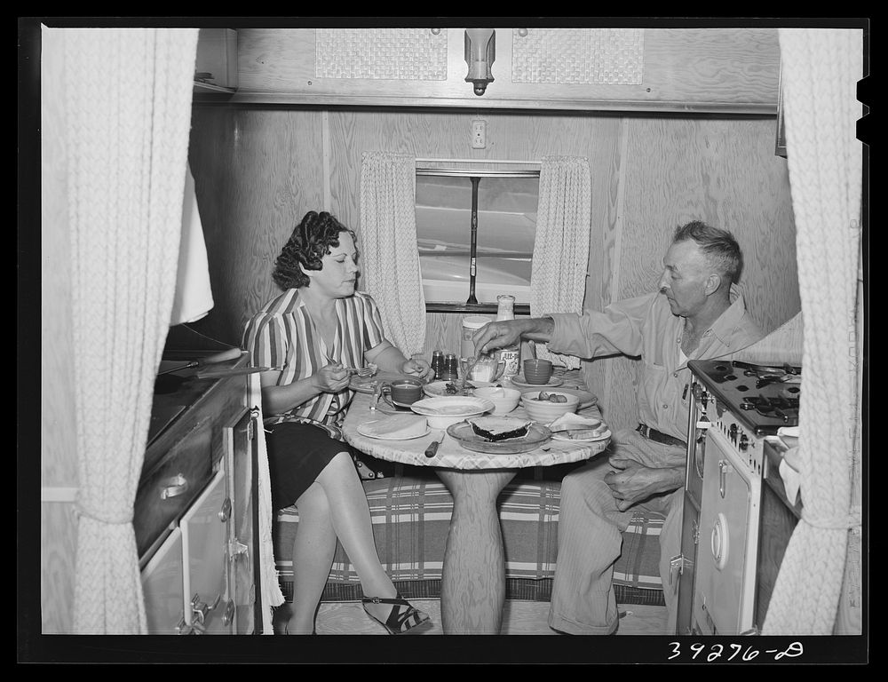 Construction worker of Kearney-Mesa and his wife have lunch in their trailer home. San Diego, California by Russell Lee