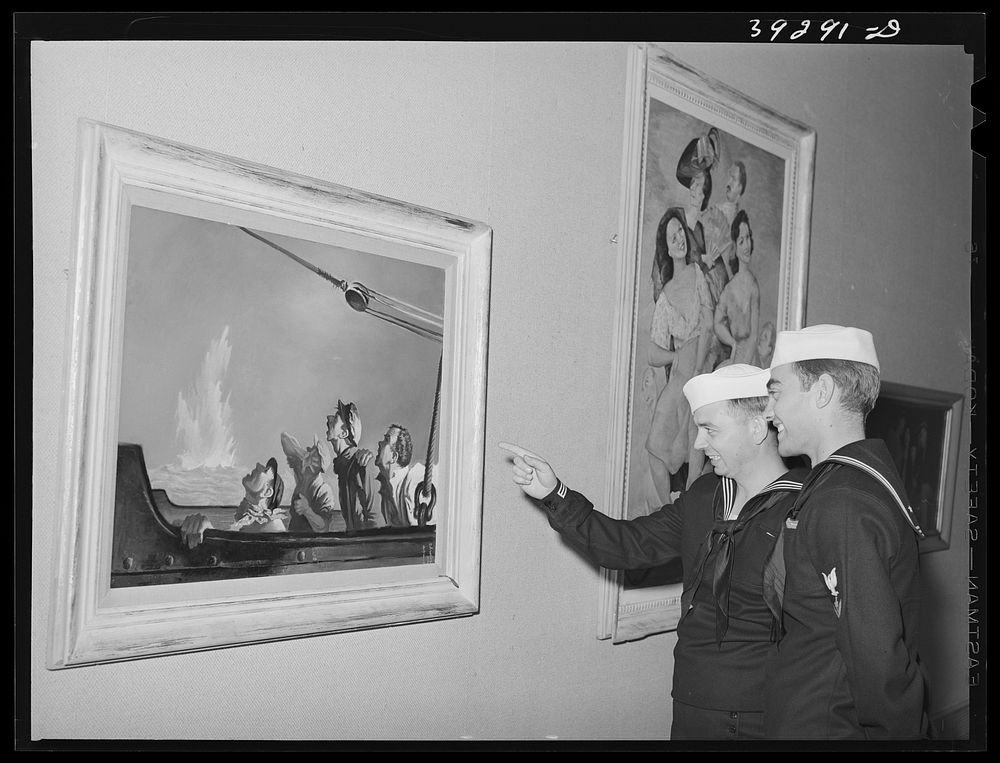 Sailors looking at paintings of George Schrieber's at the fine arts building. This is a part of the "Long Voyage Home"…