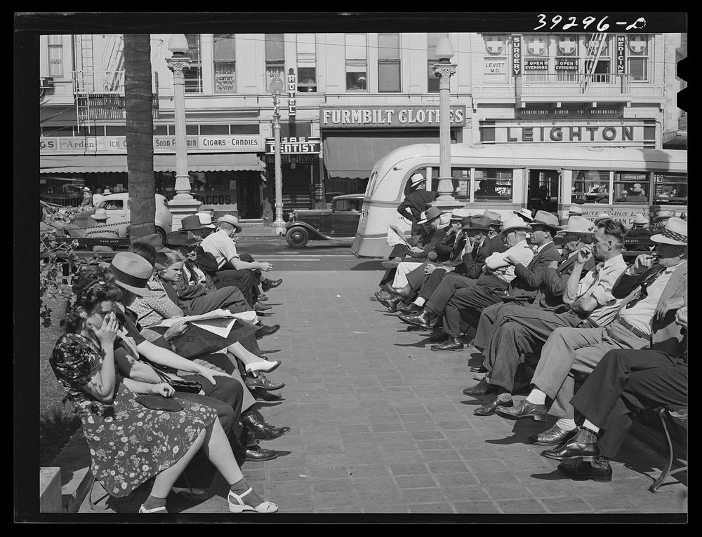 [Untitled photo, possibly related to: Sailors lined up against chain-rail in square in midtown. San Diego, California] by…