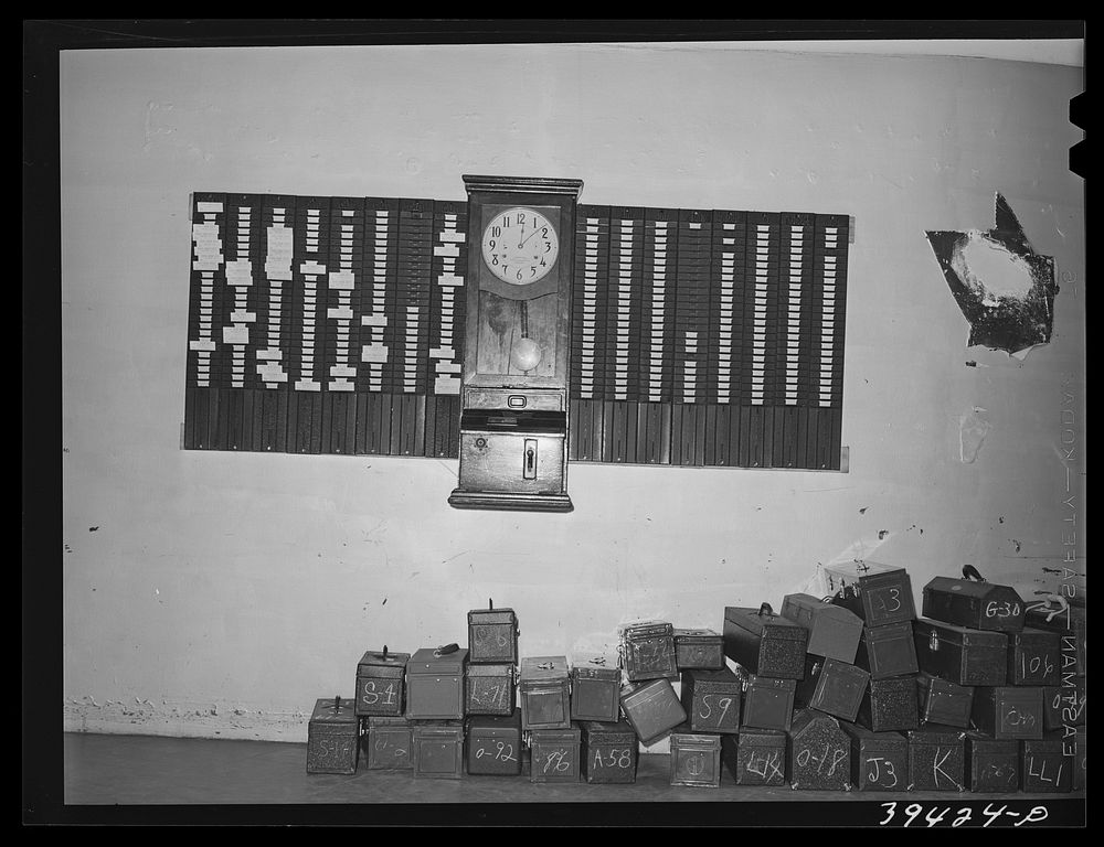 Time clock and tool boxes at the vocational school for aircraft construction workers. San Diego, California by Russell Lee