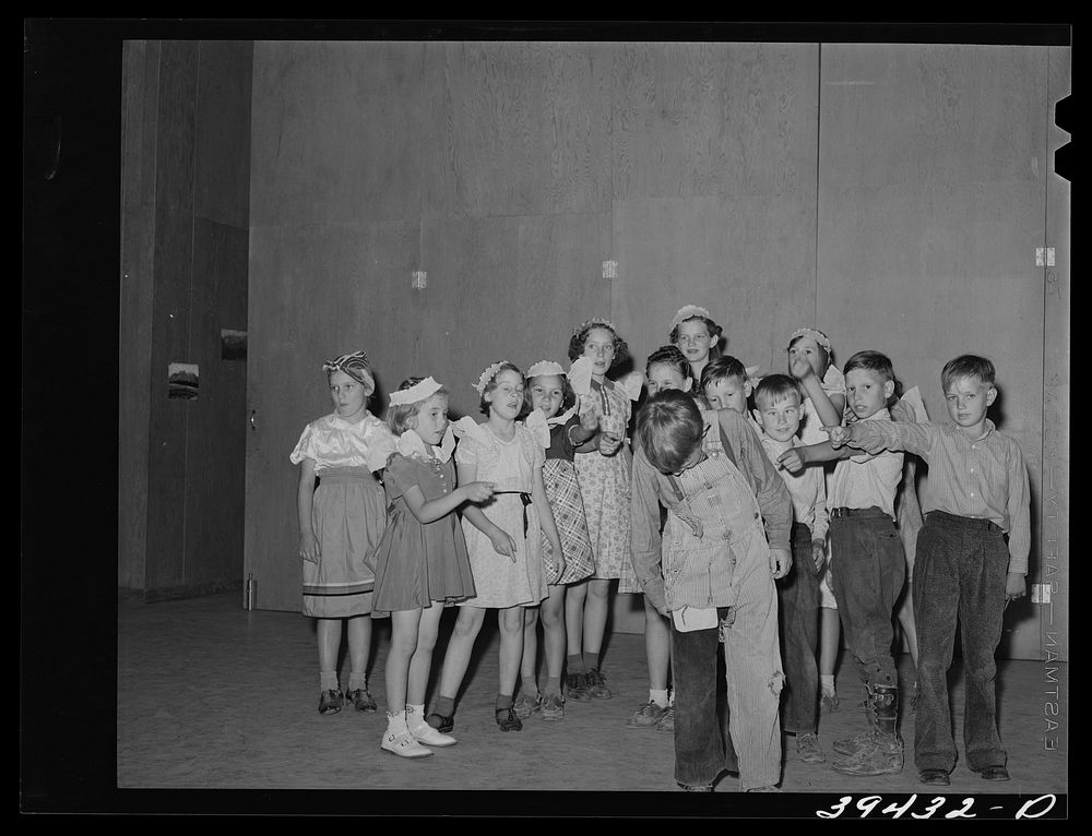 Schoolchildren in playlette at the end of the school term. FSA (Farm Security Administration) labor camp. Caldwell, Idaho by…