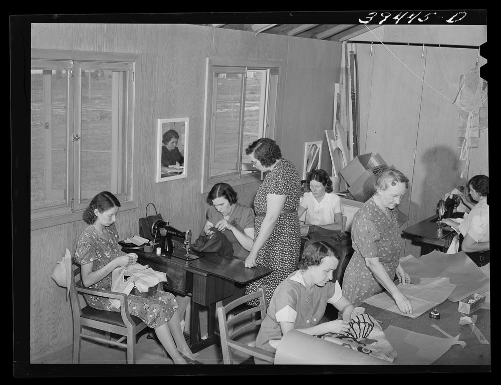 In the sewing class, a WPA (Work Projects Administration) project, at the FSA (Farm Security Administration) labor camp.…