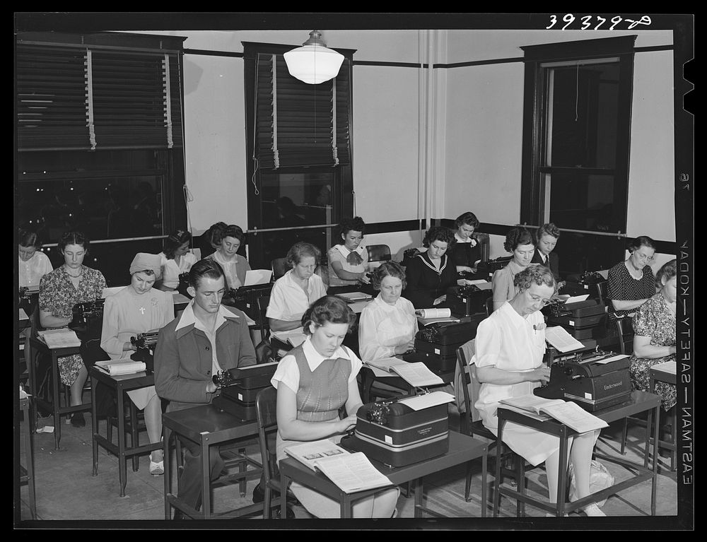 Typing class at the San Diego Vocational School. During the day high school graduates attend this school. The night classes…