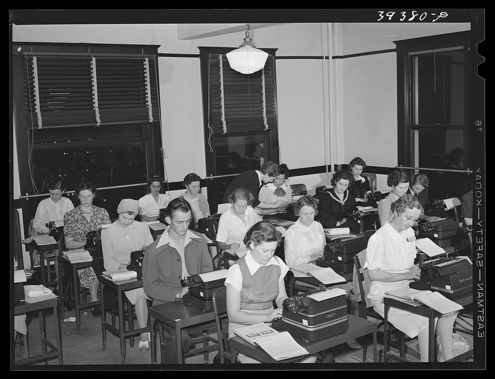 [Untitled photo, possibly related to: Typing class at the San Diego Vocational School. During the day high school graduates…