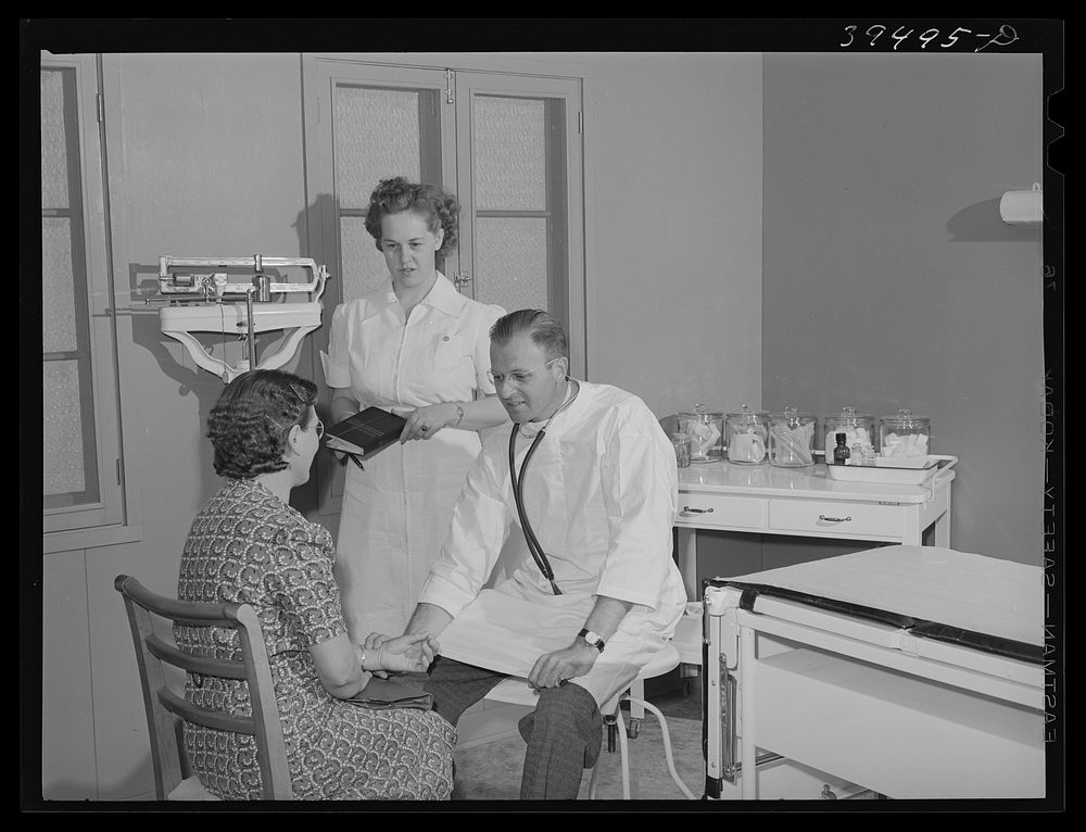Doctor and nurse with patient at the clinic of the FSA (Farm Security Administration) and farm labor camp. Caldwell, Idaho…