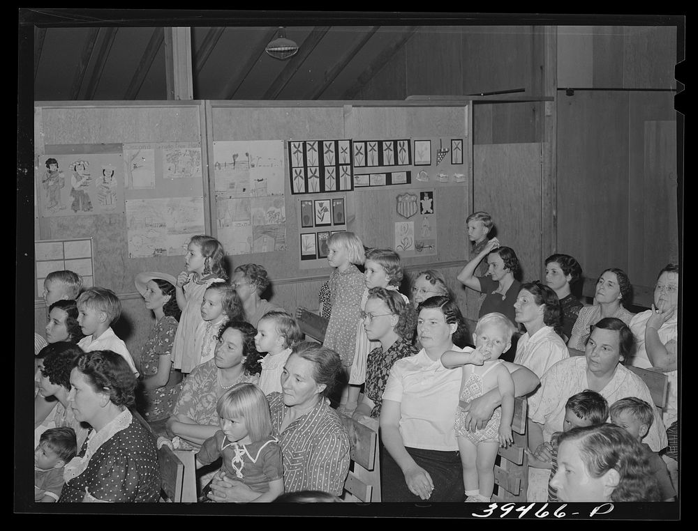 Mothers and children watching program by schoolchildren at end of term. FSA (Farm Security Administration) labor camp.…